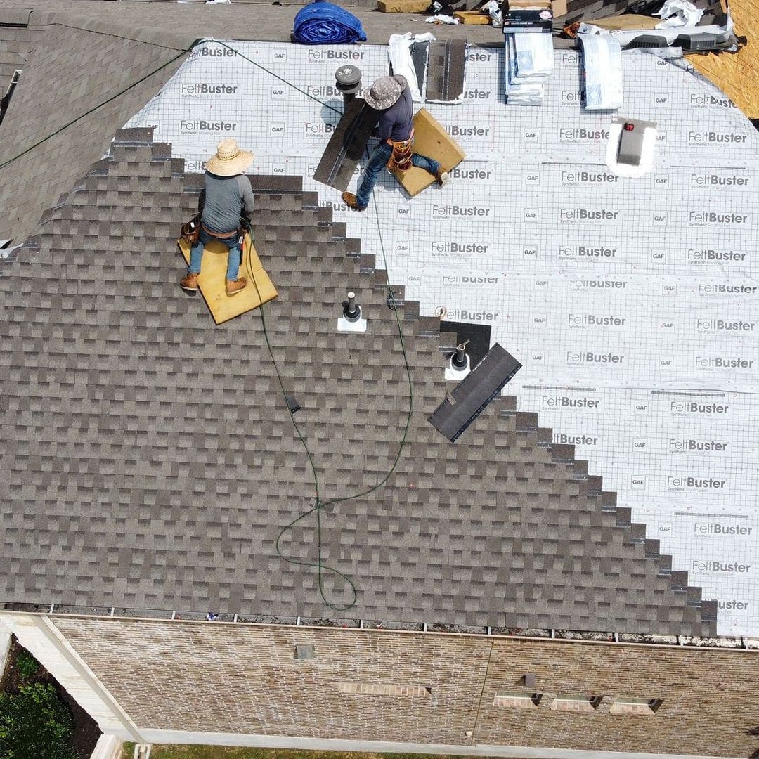 Roofing crew installing architectural shingles over GAF underlayment from the Gold Coast job gallery